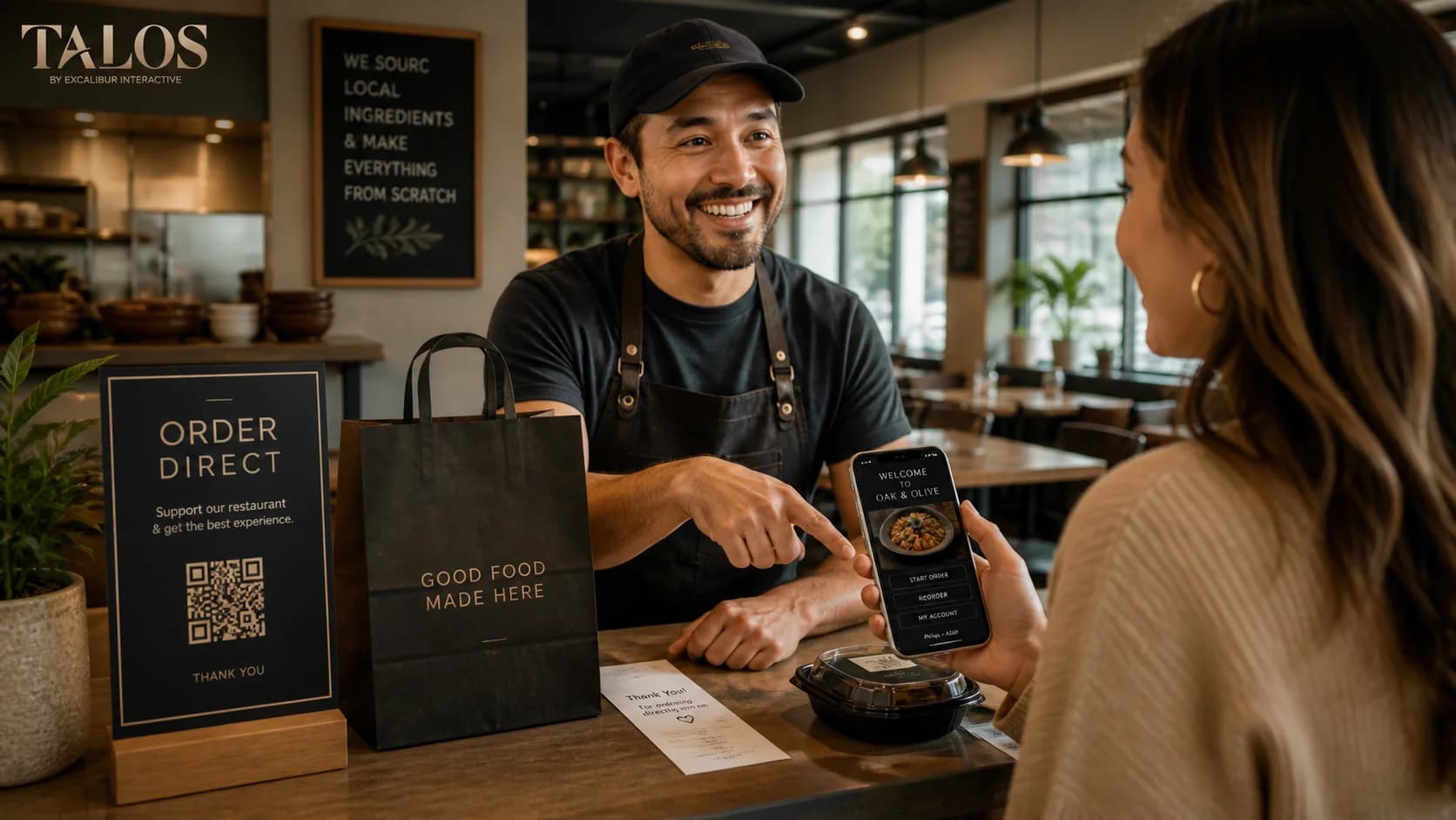A restaurant manager enthusiastically explaining direct ordering options to a customer at the counter in a warm, welcoming restaurant setting.